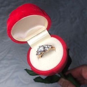 Two 14k gold rings w CZs.